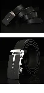Detail of black leather business belt with silver automatic buckle and arrow patterns