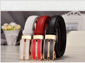 Detail view of women's leather belts with rhinestone alloy buckles in black, white, and red
