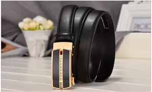 Detailed view of women's black leather belt with rhinestone-studded gold alloy buckle