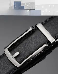 Detail of men's black lychee leather belt with brushed silver automatic metal buckle