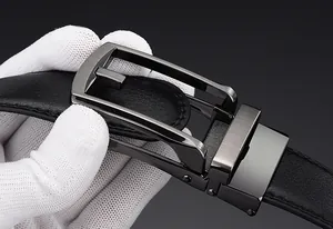 Close-up of men's business belt featuring a gunmetal alloy buckle and black leather texture