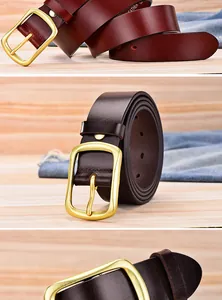 Close-up of premium red-brown leather belt with gold metal pin buckle on denim fabric