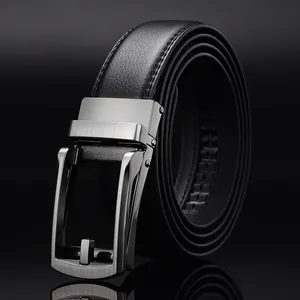 Detail of men's business belt featuring a black strap and brushed alloy automatic buckle