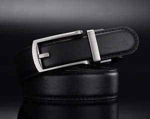 Macro detail of black lychee grain leather belt with brushed silver alloy pin buckle