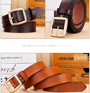 Detail of dark brown and camel leather belts with vintage square gold buckles
