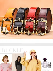 Detailed close-up of vintage embossed floral leather belts with antique gold metal buckles