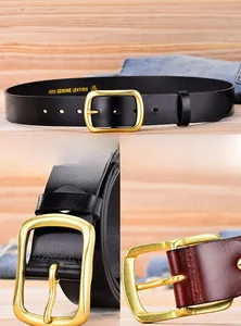 Detail of male genuine leather belts in black and brown with matte gold metal buckle