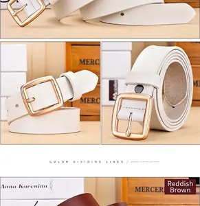 Detail of genuine leather belts in white and reddish brown with gold needle buckles