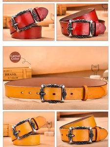 Detail of vintage embossed leather belts with metal pin buckle in camel and dark red