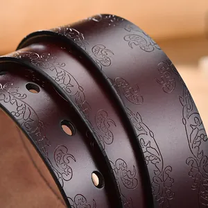Vintage embossed genuine leather belt for women with intricate floral patterns