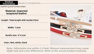 Detail view of skinny patent leather belt with sparkling rhinestone flower buckle for women