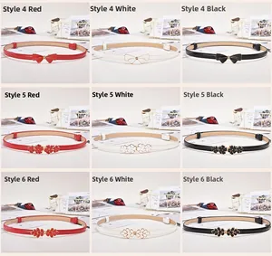 Detail view of women's thin decorative belts with sparkling rhinestone butterfly buckles