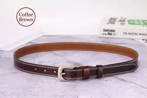 Detail of coffee genuine leather belt with double stitching and matte silver pin buckle