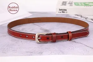 Close-up of reddish brown leather belt with double white stitching and silver pin buckle