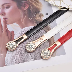 Women thin belts in black white and red with golden crystal rhinestone petal buckles
