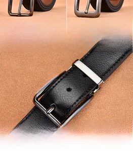 Macro detail of men's black leather belt with lychee texture and matte alloy buckle