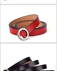 Detail of red and black skinny leather belts with round matte metal pin buckles for women