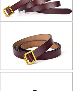 Vue macro d'une ceinture en cuir bordeaux avec boucle rectangulaire en or mat