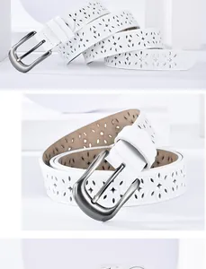Detailed view of the laser-cut floral pattern and silver buckle on white leather belt