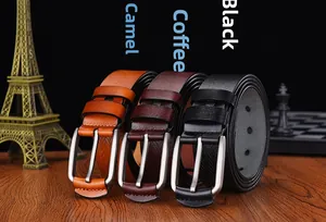 Detailed view of leather belts with herringbone embossing and silver-gray buckles
