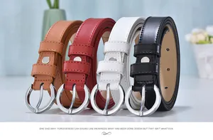 Close-up of four women's leather belts in brown, red, white, and black with silver round buckles