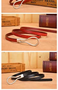 Detailed view of genuine leather belts with lychee texture and silver water drop buckle