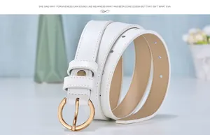 Detailed view of white genuine leather thin belt with elegant gold round buckle on blue background