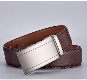 Detail of dark brown leather belt featuring cross-grain texture and brushed metal buckle