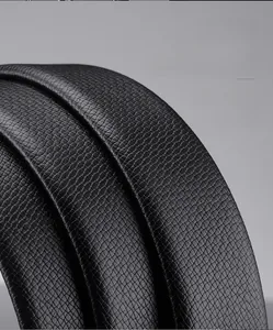 Macro shot of flexible black lychee grain cowhide leather belt showing premium texture
