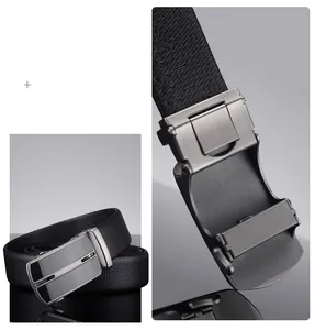 Close-up of brushed metal automatic buckle and black lychee texture leather belt