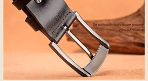 Detail of dark brown leather belt with durable alloy pin buckle and vintage stitching