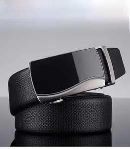 Detail of men's black leather belt with a brushed metal alloy automatic buckle