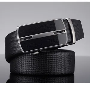 Close-up of black lychee grain leather belt with silver brushed metal automatic buckle