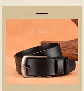 Detail of black leather belt with textured silver alloy buckle and wood decor