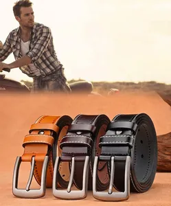 Detail of leather belts with alloy pin buckles in black, brown and orange colors