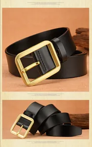 Detailed view of black leather belt with golden pin buckle and brushed metal finish
