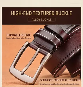 Detail of brushed alloy pin buckle on dark brown leather belt with white stitching