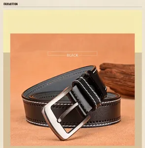 Black leather belt detail with white double stitching and matte metal pin buckle