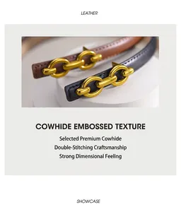 Detailed close-up of textured leather belts with golden chain buckles and fine stitching