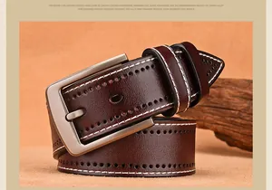 Detail of dark brown leather belt featuring white stitching and brushed alloy buckle