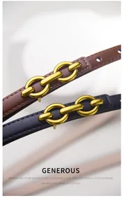 Detailed macro view of thin leather belts with gold interlocking chain metal buckles