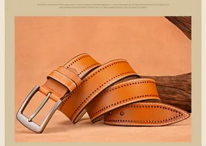 Detailed close-up of brown genuine leather belt with white stitching and brushed metal buckle