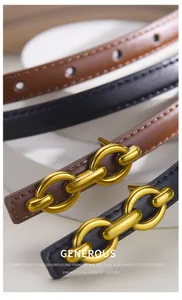 Detail of slim black and brown leather waist belts with elegant gold chain buckle