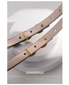Detail of slim beige leather belt for women featuring a gold square metal buckle and neat stitching
