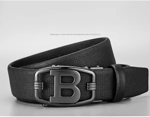 Detail of ergonomic curved metal buckle with B logo on black lychee leather belt