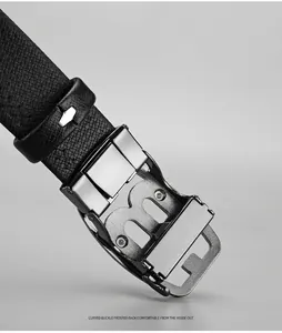 Detail of men's leather belt featuring a curved metal alloy buckle and lychee texture