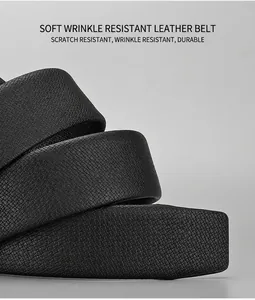 Close-up of black genuine leather belt strap with fine embossed texture and oiled edges