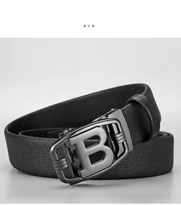Detail of black leather belt with crosshatch texture and gunmetal alloy B buckle