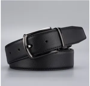 Macro detail of men's black Saffiano leather business belt with dark chrome metal buckle