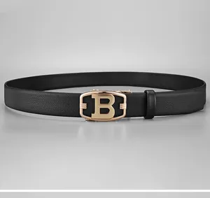 Close-up of black leather belt with golden B-shaped metal automatic buckle buckle